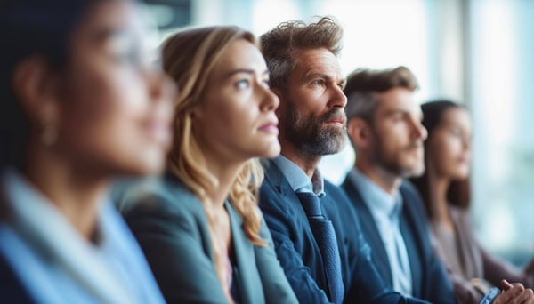 Group of business people listening to a presentation
