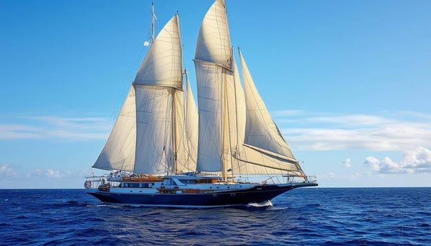 a large sail boat on the open ocean