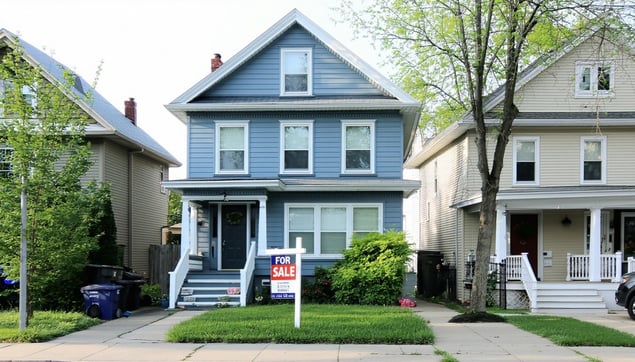 blue townhouse with a For Sale sign in front of it-Mar-24-2025-05-03-11-4858-PM
